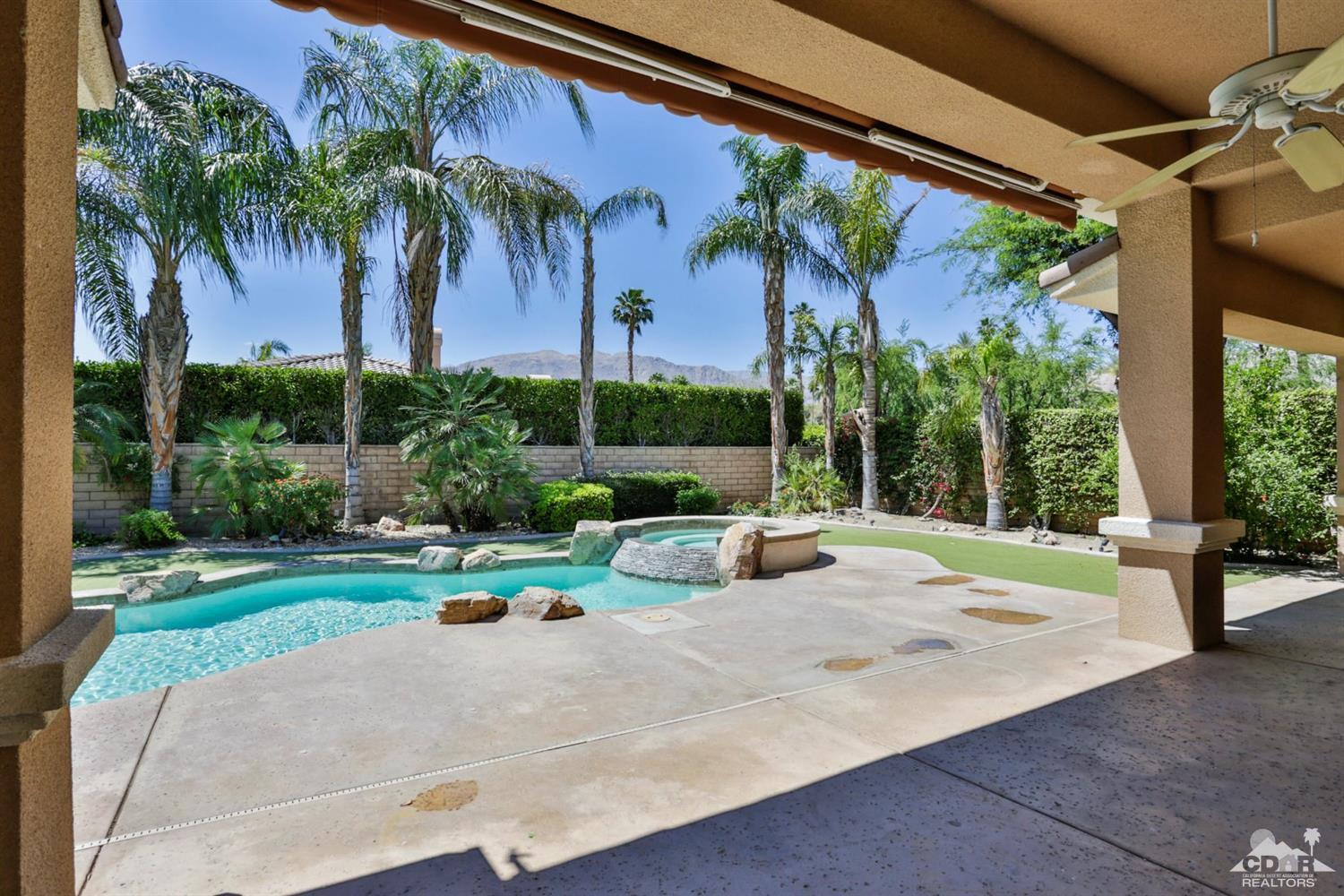 5 University Circle Rancho Mirage, CA 92270 - Photo 48 of 60 a view of a park with potted plants and palm trees