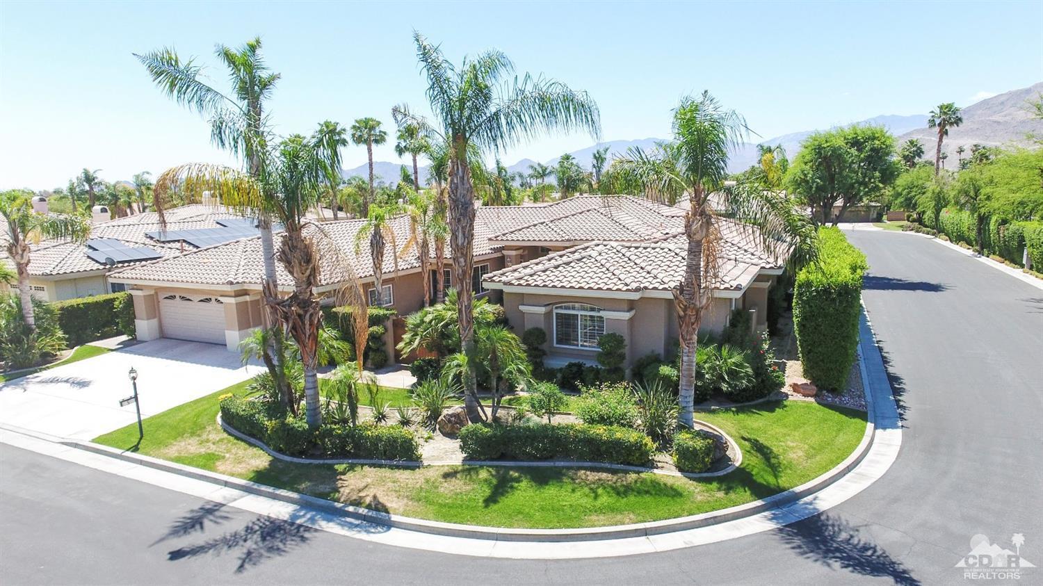 5 University Circle Rancho Mirage, CA 92270 - Photo 52 of 60 a view of a house with a small yard and palm trees
