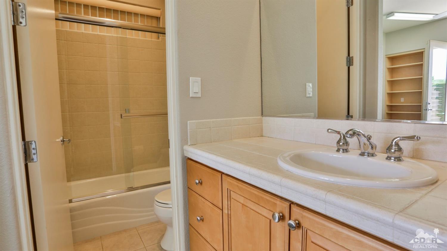 5 University Circle Rancho Mirage, CA 92270 - Photo 54 of 60 a bathroom with a sink and a mirror