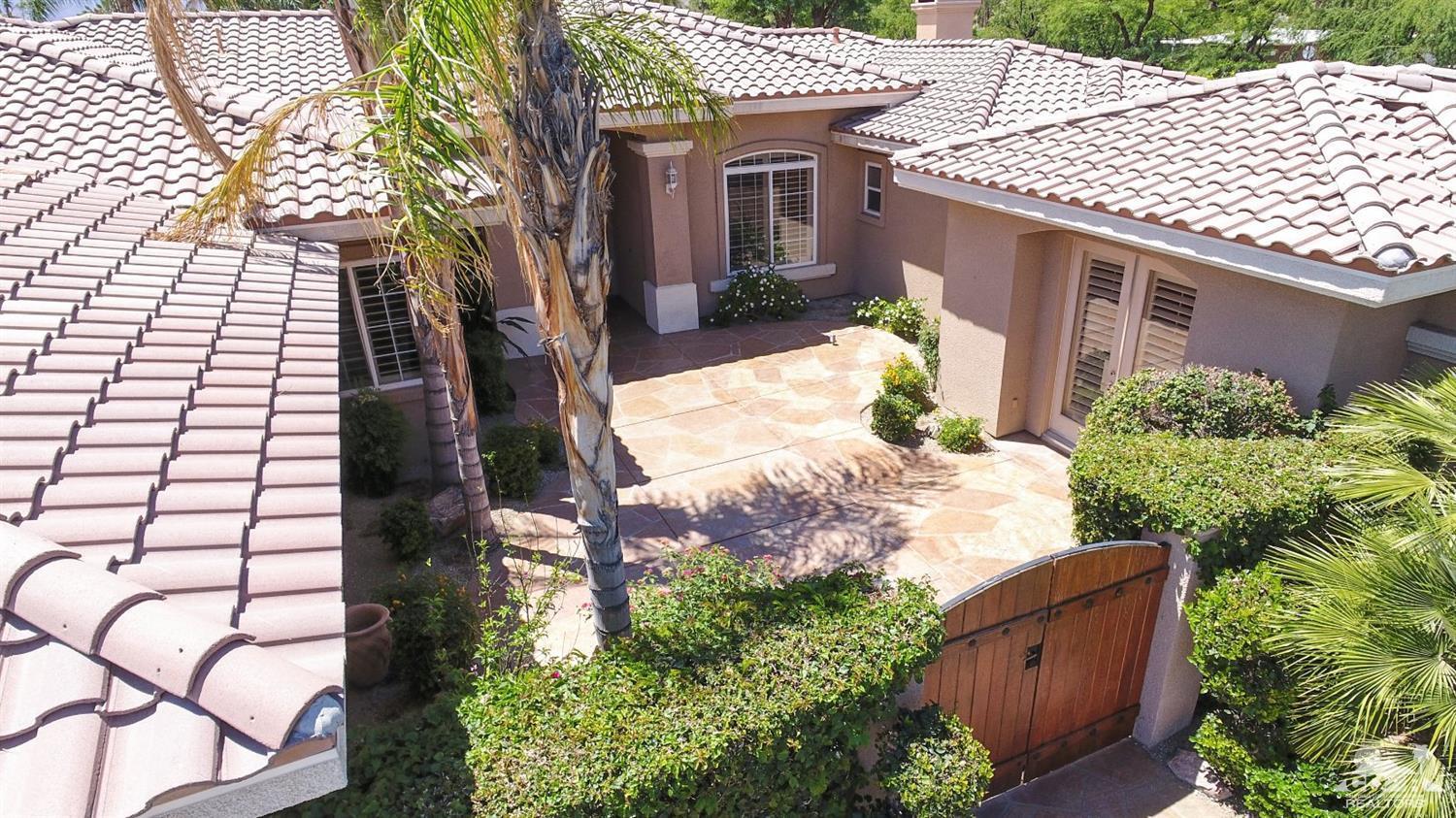 5 University Circle Rancho Mirage, CA 92270 - Photo 60 of 60 front view of a house with a yard