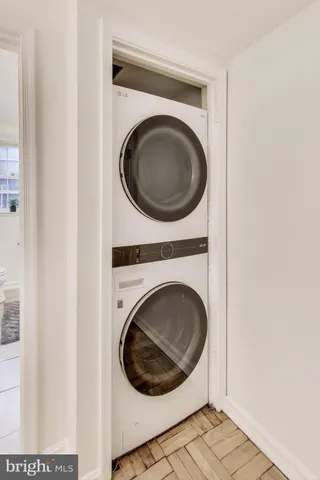 a view of a hallway with washer and dryer
