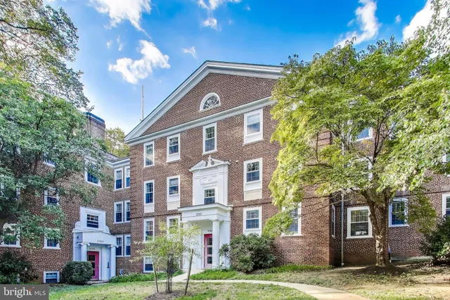 a front view of a building with garden