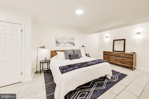 a bedroom with a bed and a cabinets