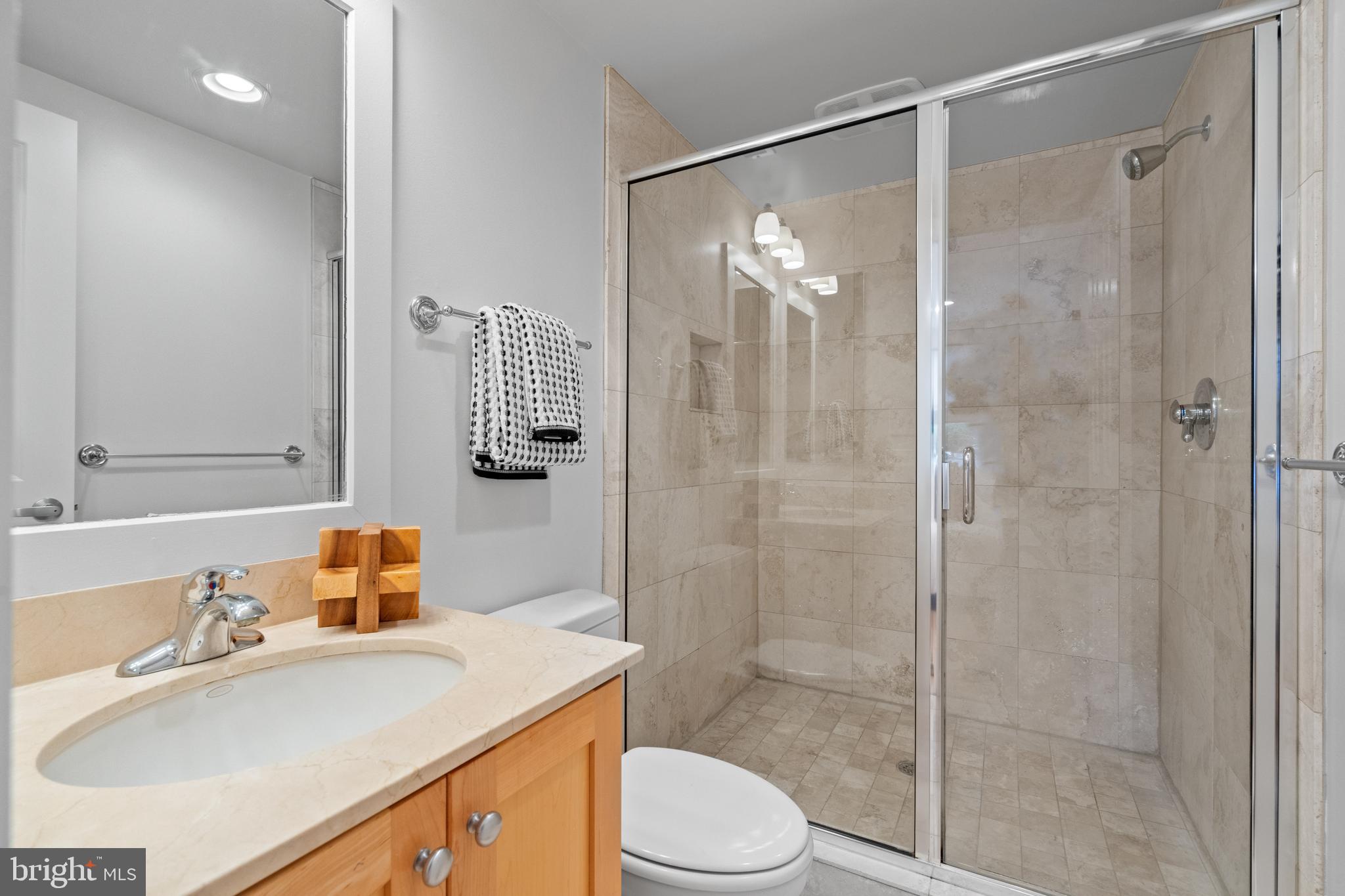 1421 Chapin Street Northwest, Unit 102 Washington, DC 20009 - Photo 5 of 37 a bathroom with a sink toilet and shower