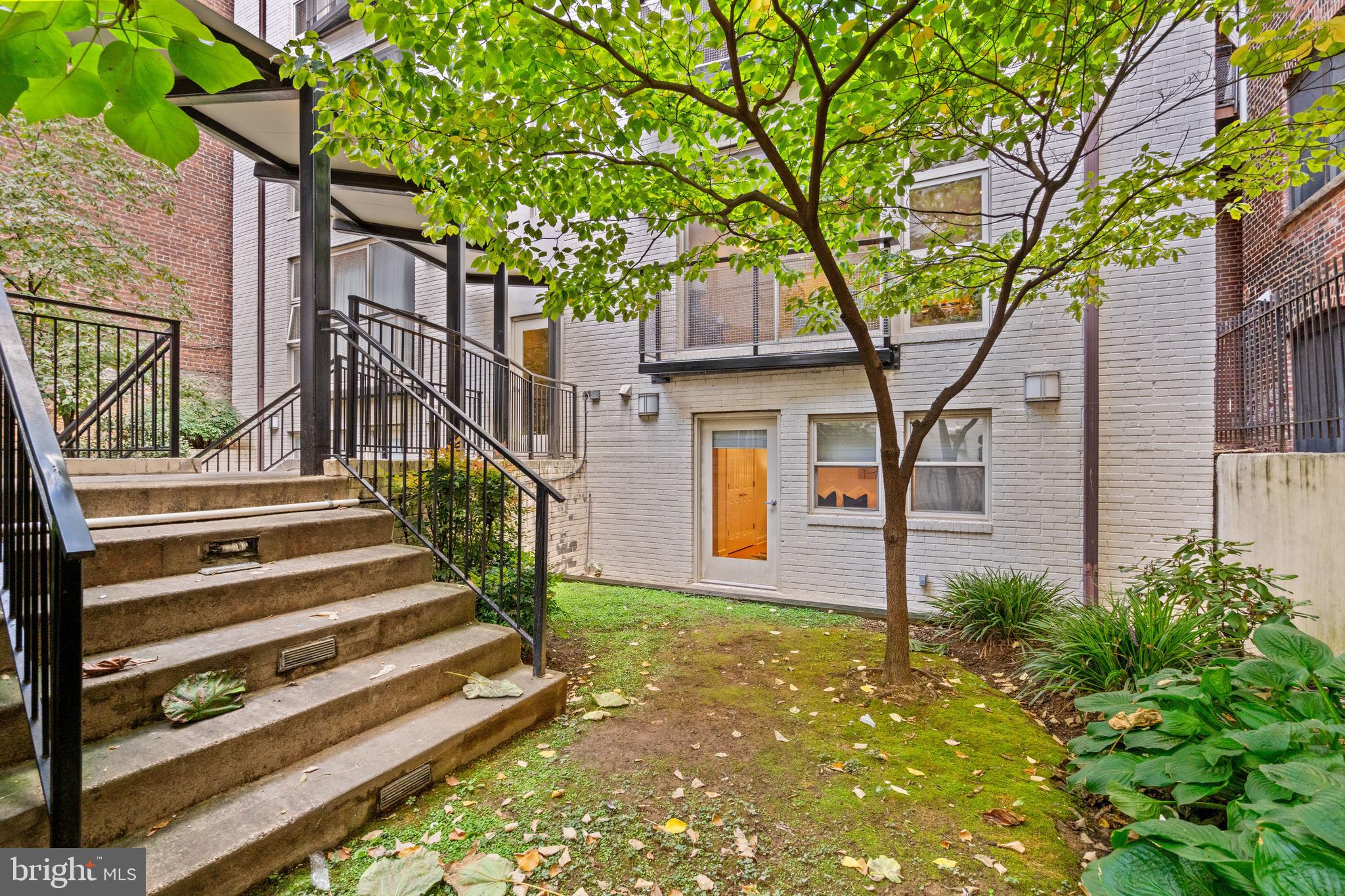 1421 Chapin Street Northwest, Unit 102 Washington, DC 20009 - Photo 7 of 37 a front view of a house with a yard
