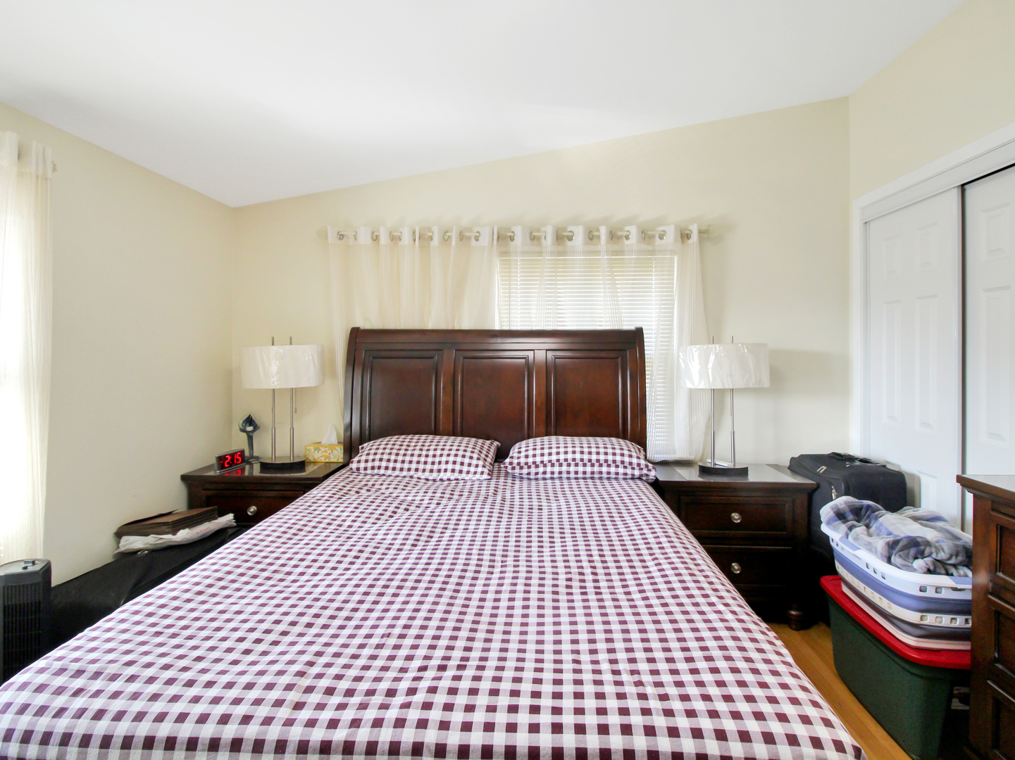 7806 80th Place Bridgeview, IL 60455 - Photo 8 of 16 a bedroom with a bed and wooden floor