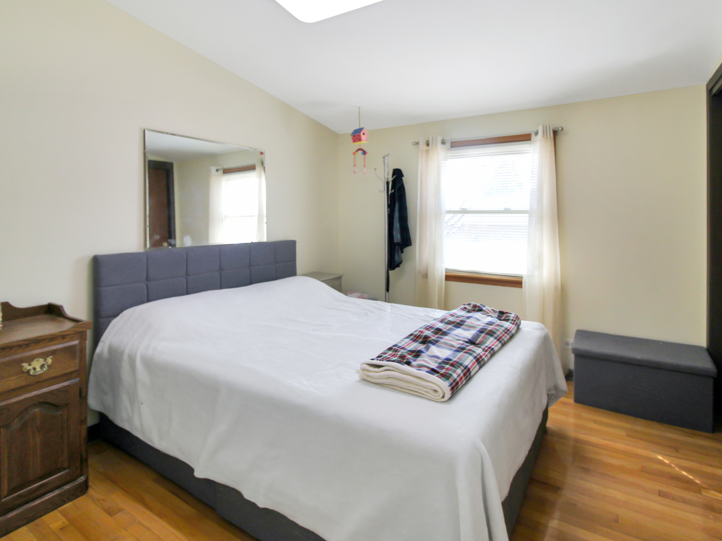 7806 80th Place Bridgeview, IL 60455 - Photo 10 of 16 a bedroom with a bed and a window
