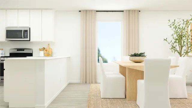 a kitchen with a refrigerator and a stove