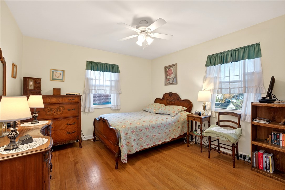 1237 Laurelwood Road Dayton, OH 45409 - Photo 18 of 56 This inviting bedroom features hardwood flooring and abundant natural light, offering a comfortable living space.