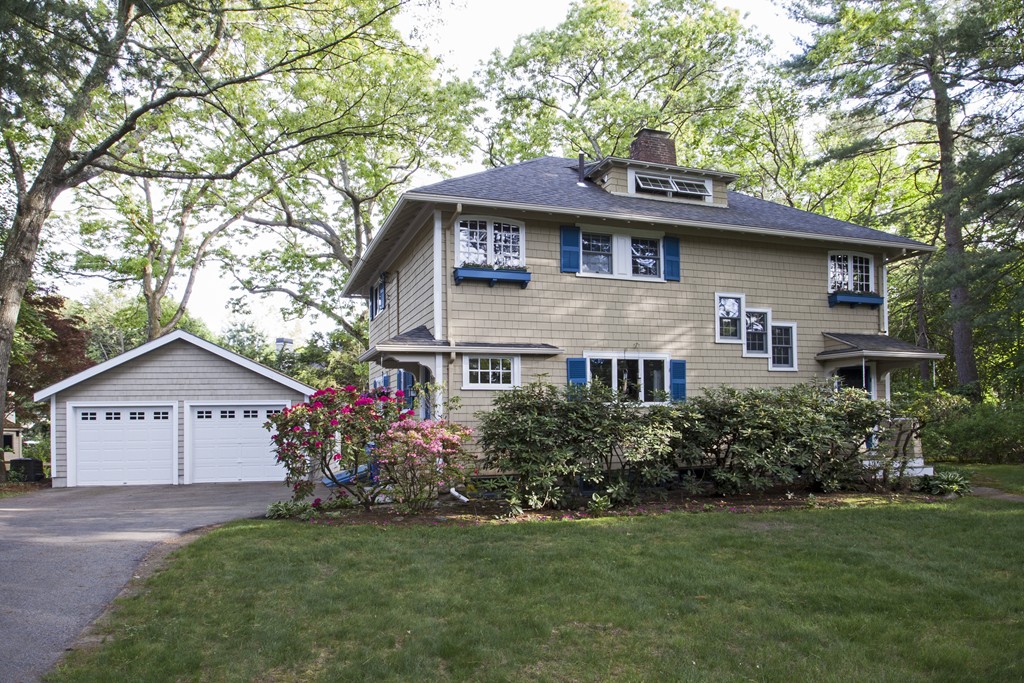 162 Waban Avenue Newton, MA 02468 - Photo 1 of 24 a front view of a house with a garden and trees