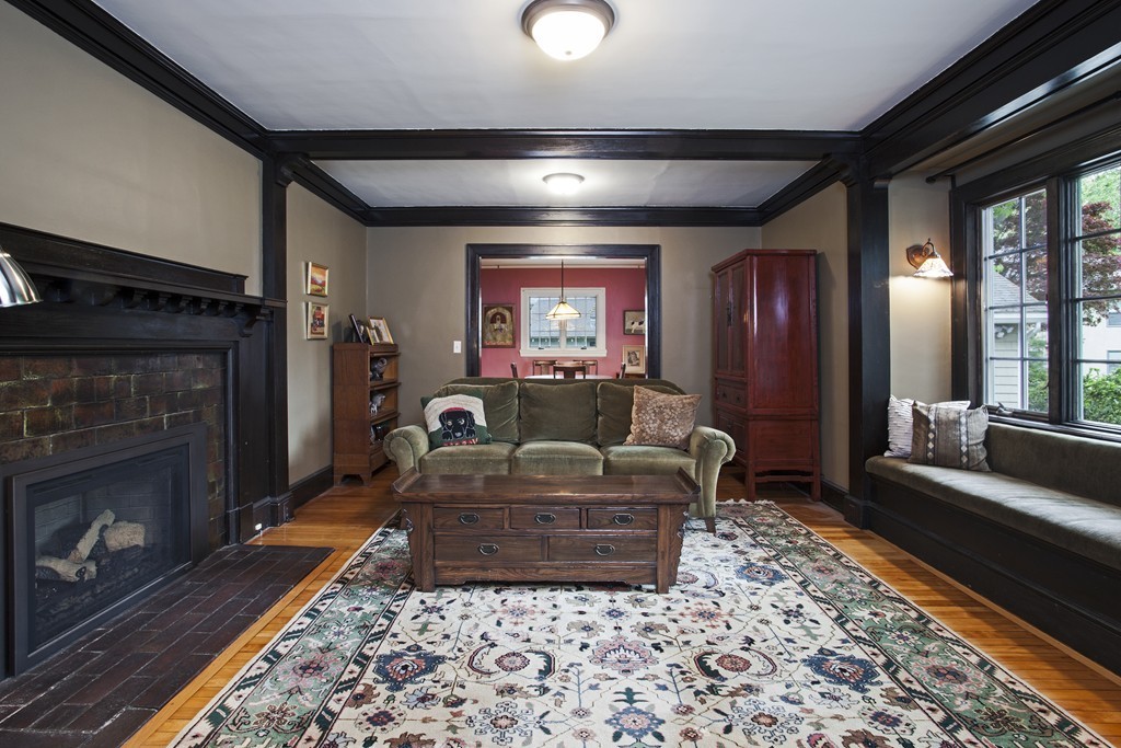 162 Waban Avenue Newton, MA 02468 - Photo 11 of 24 a living room with furniture and a fireplace