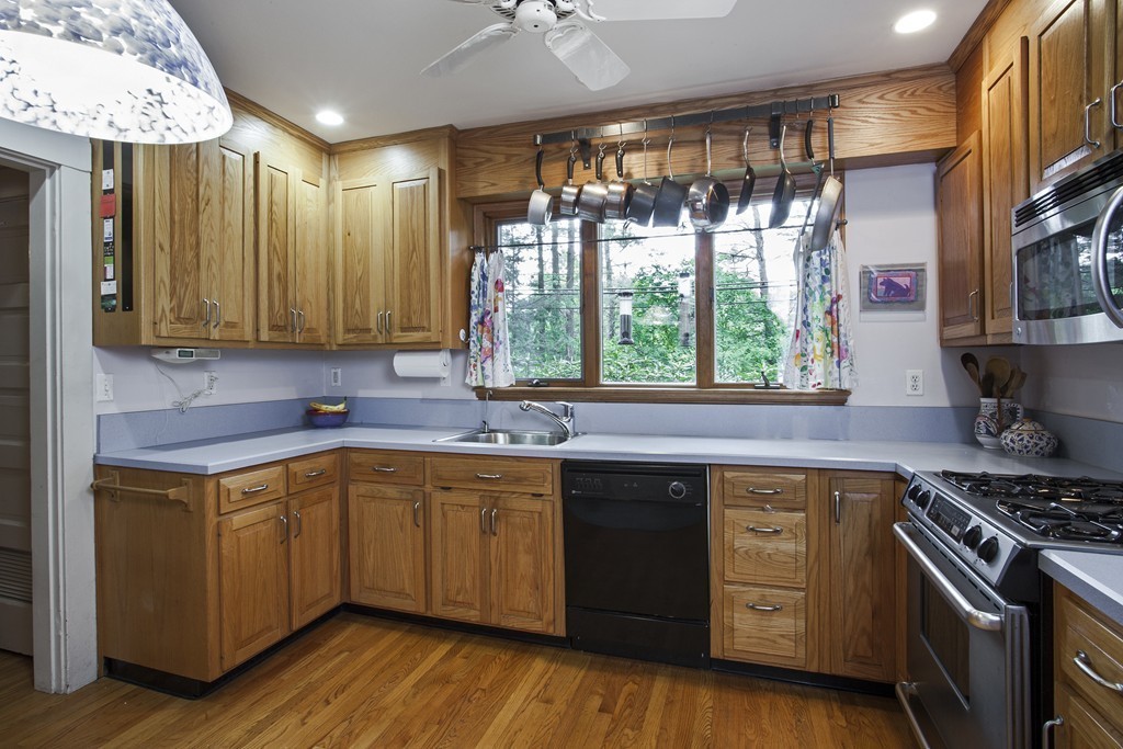 162 Waban Avenue Newton, MA 02468 - Photo 14 of 24 a kitchen with a sink stove and cabinets