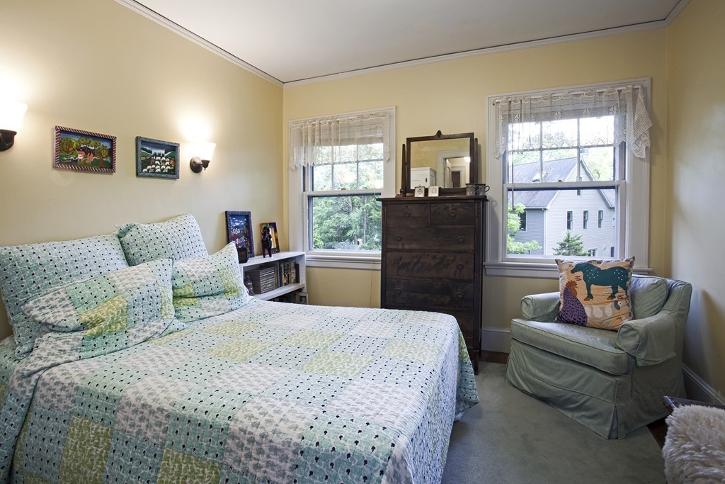 162 Waban Avenue Newton, MA 02468 - Photo 18 of 24 a bed room with a bed and a couch