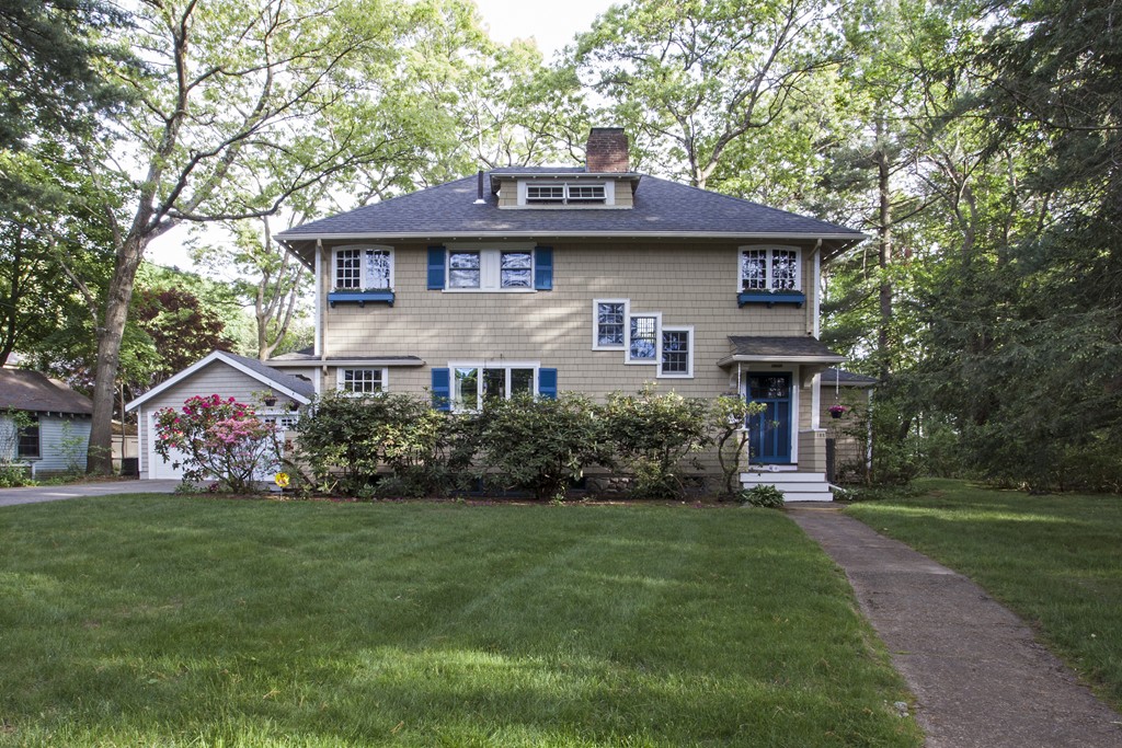 162 Waban Avenue Newton, MA 02468 - Photo 2 of 24 a front view of a house with a garden