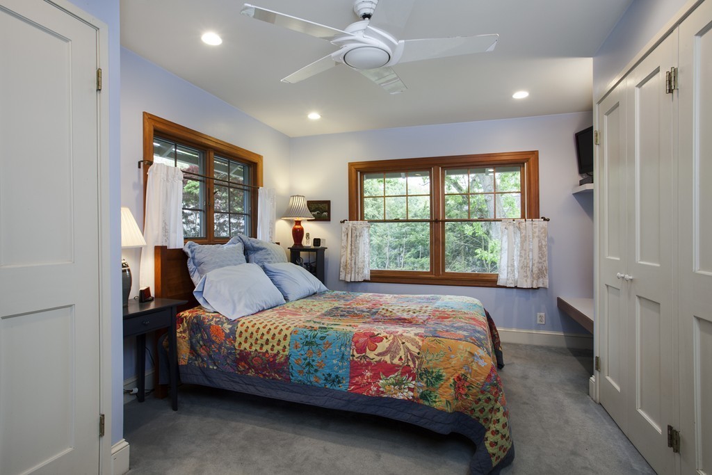 162 Waban Avenue Newton, MA 02468 - Photo 21 of 24 a bedroom with a large bed and a window