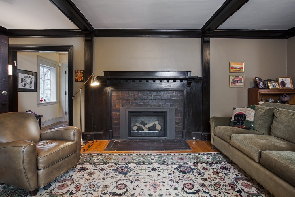 162 Waban Avenue Newton, MA 02468 - Photo 9 of 24 a living room with furniture and a fireplace