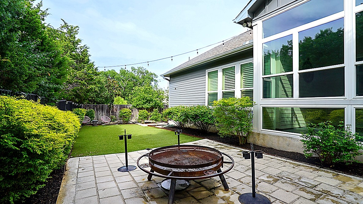 629 Germander Road Leander, TX 78641 - Photo 32 of 38 a view of a backyard with table and chairs and potted plants