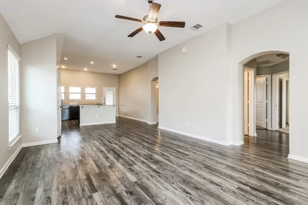 a view of livingroom with hardwood floor and a ceiling fan