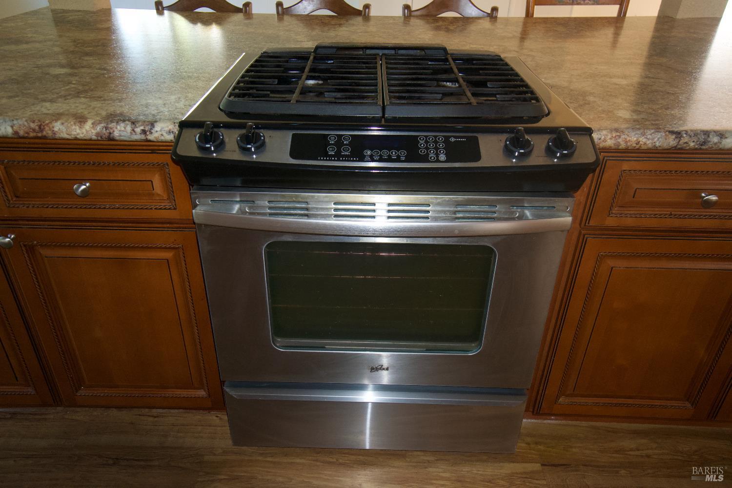 2412 Foothill Boulevard, Unit 124 Calistoga, CA 94515 - Photo 17 of 49 a stove top oven sitting inside of a kitchen
