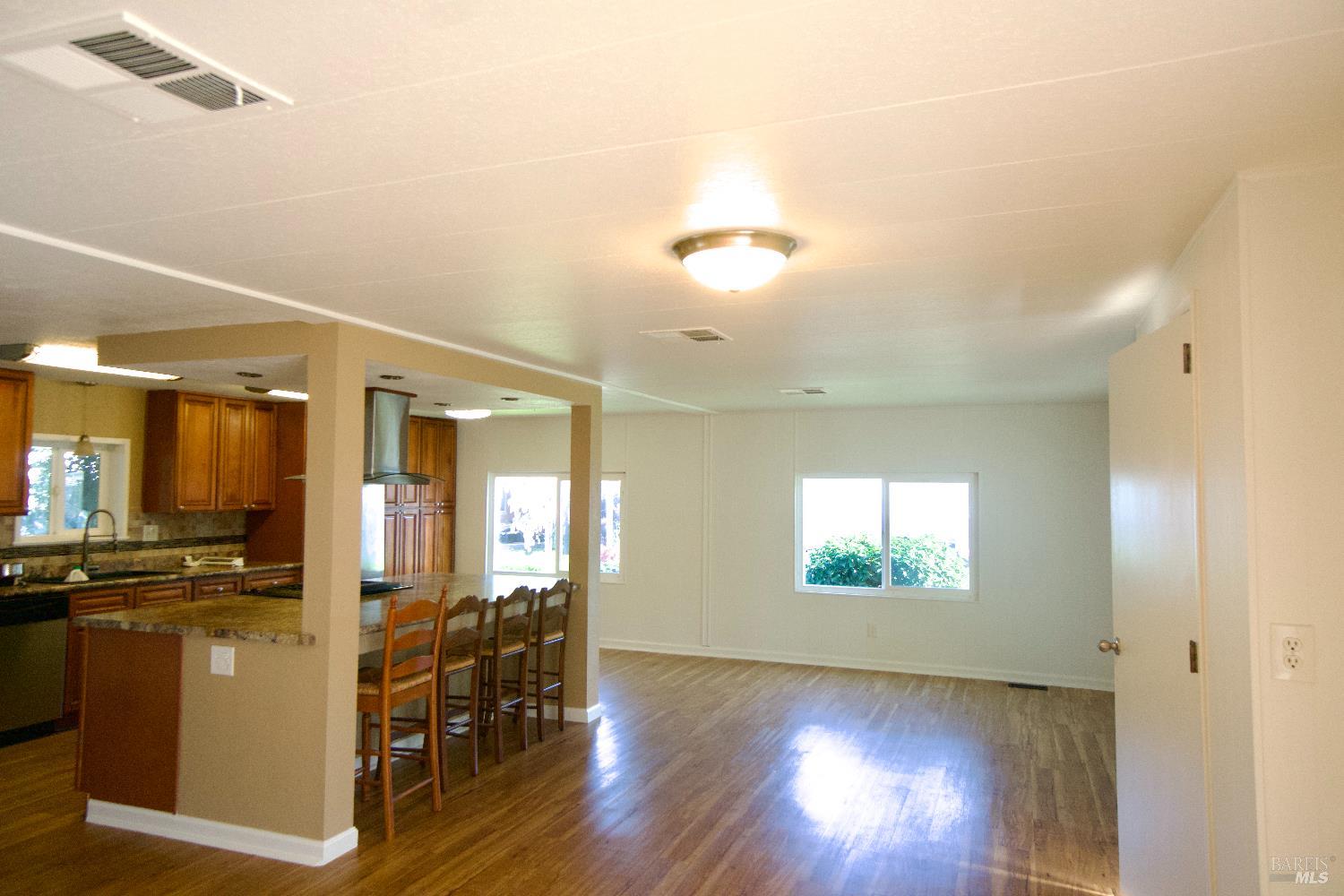2412 Foothill Boulevard, Unit 124 Calistoga, CA 94515 - Photo 24 of 49 a view of a room with wooden floor and staircase