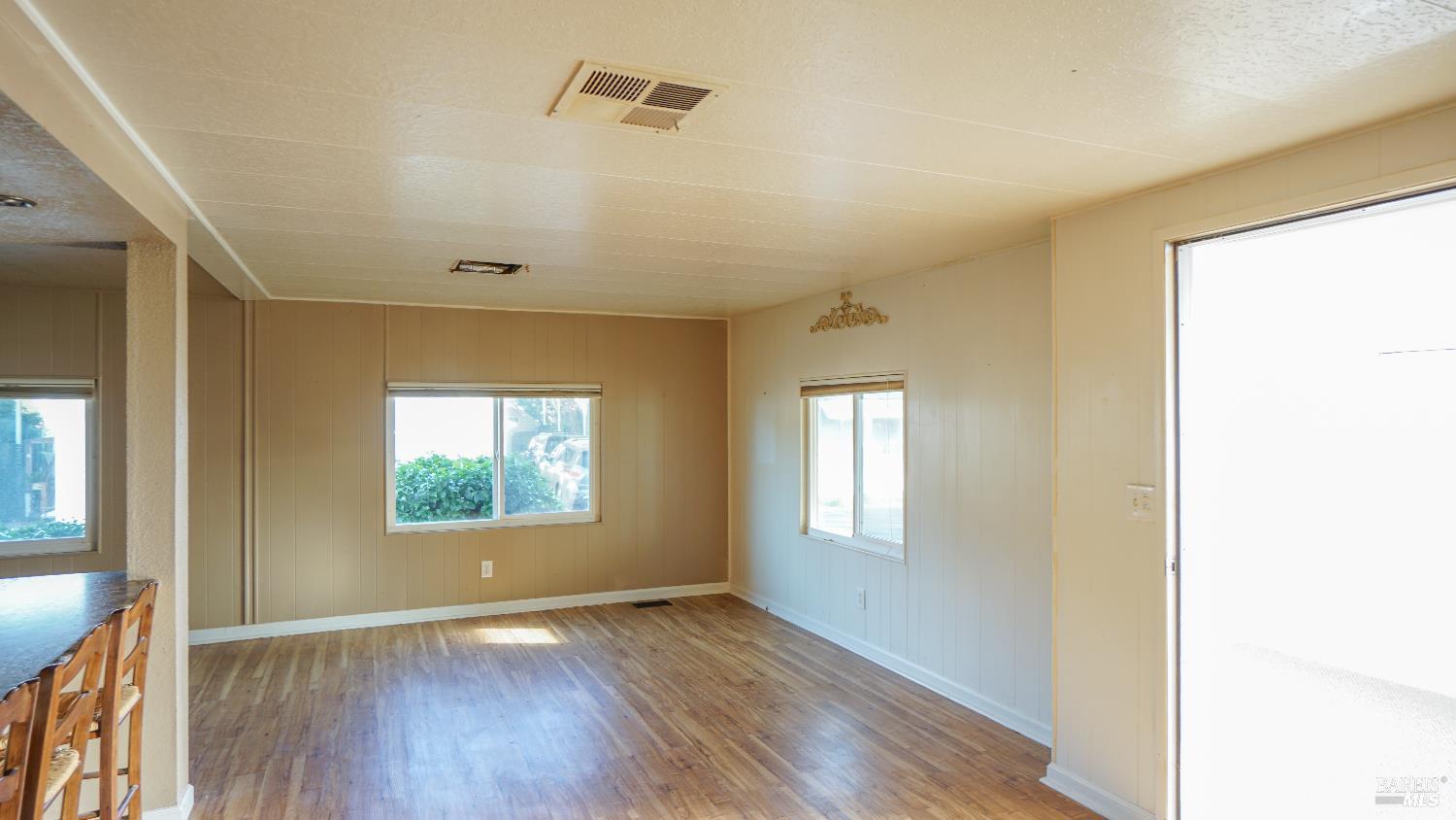 2412 Foothill Boulevard, Unit 124 Calistoga, CA 94515 - Photo 26 of 49 a view of an empty room with wooden floor and a window