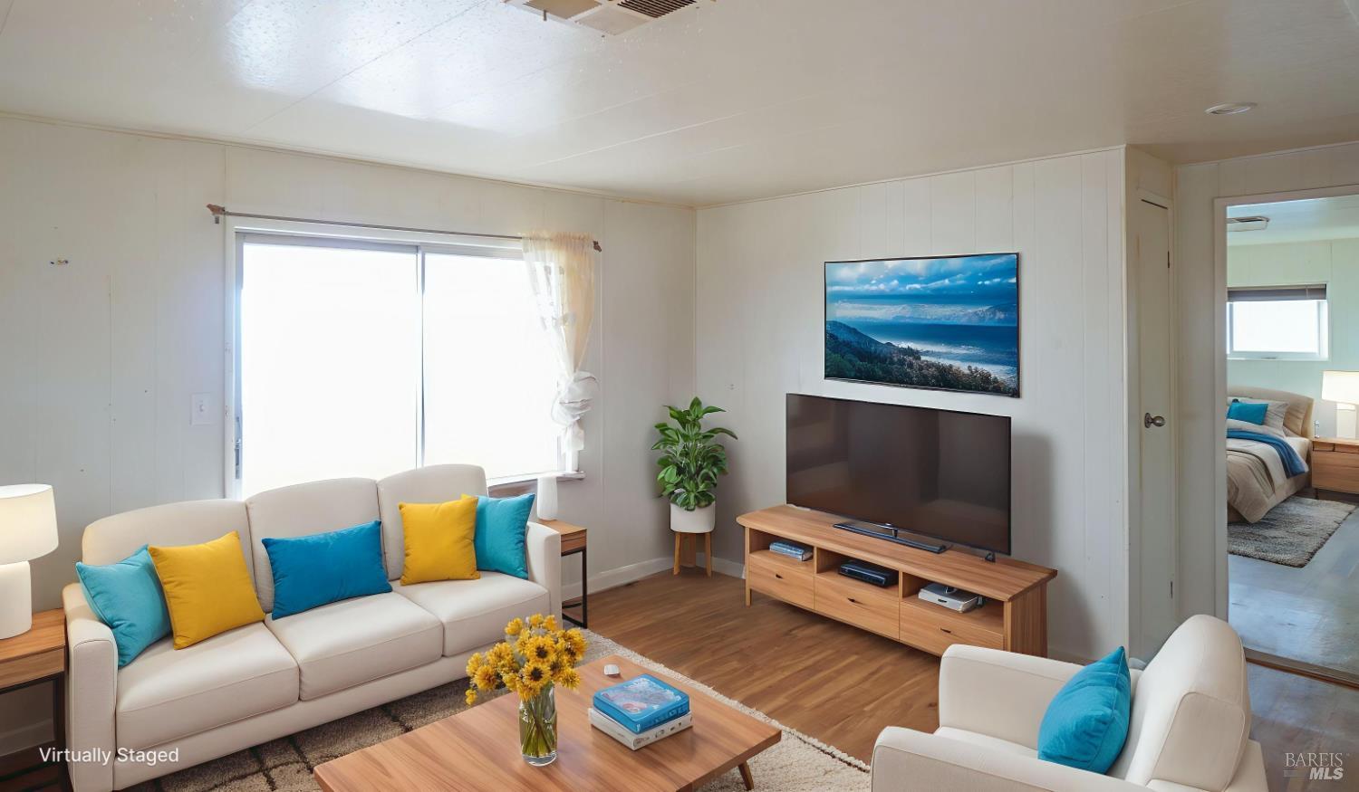 2412 Foothill Boulevard, Unit 124 Calistoga, CA 94515 - Photo 27 of 49 a living room with furniture and a flat screen tv