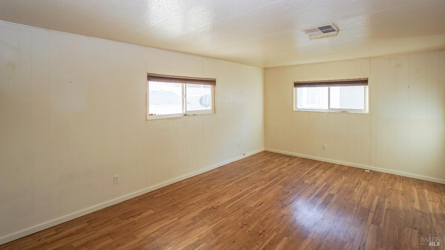 2412 Foothill Boulevard, Unit 124 Calistoga, CA 94515 - Photo 31 of 49 wooden floor in an empty room with a window