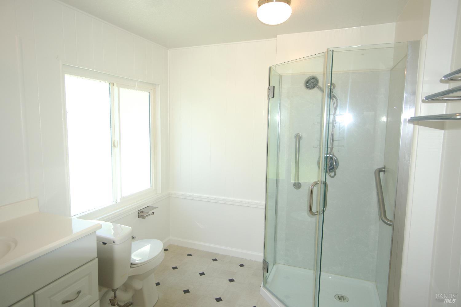 2412 Foothill Boulevard, Unit 124 Calistoga, CA 94515 - Photo 38 of 49 a bathroom with a bathtub shower sink vanity and a toilet