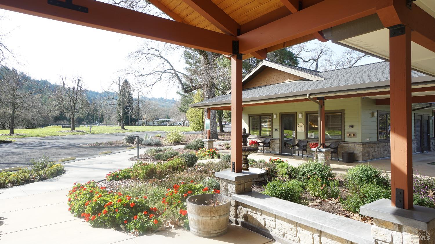 2412 Foothill Boulevard, Unit 124 Calistoga, CA 94515 - Photo 43 of 49 a view of a house with backyard porch and sitting area