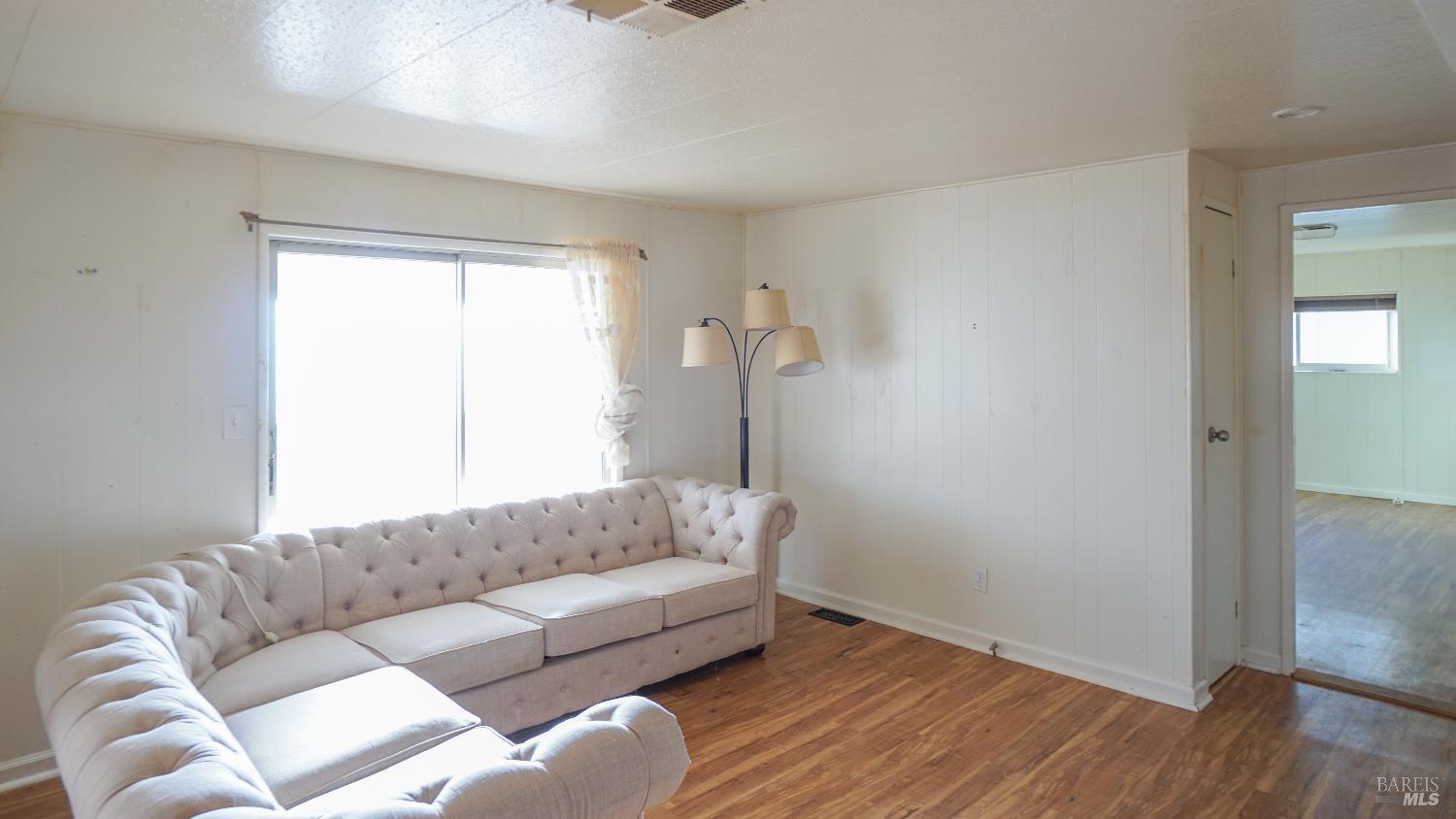 2412 Foothill Boulevard, Unit 124 Calistoga, CA 94515 - Photo 47 of 49 a living room with a couch and a window