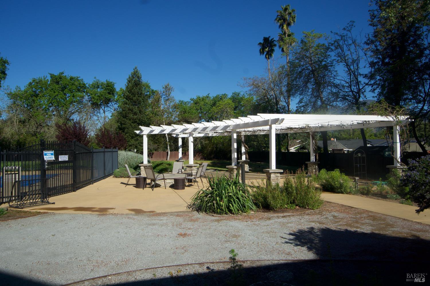 2412 Foothill Boulevard, Unit 124 Calistoga, CA 94515 - Photo 48 of 49 a view of a house with backyard sitting area and garden