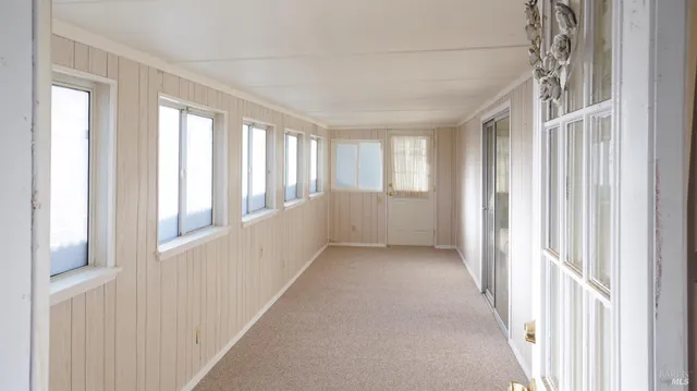 a view of an empty room and window