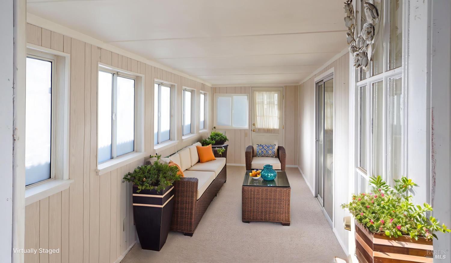 2412 Foothill Boulevard, Unit 124 Calistoga, CA 94515 - Photo 6 of 29 a living room filled with furniture and a potted plant