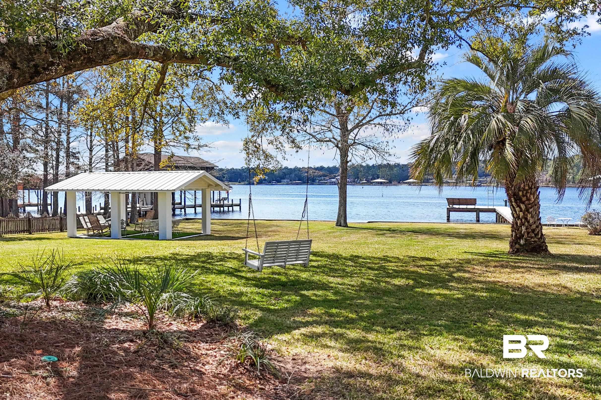 9459 Soldier Creek Road Lillian, AL 36549 - Photo 34 of 54 Surrounding community with a gazebo, a lawn, and a water view
