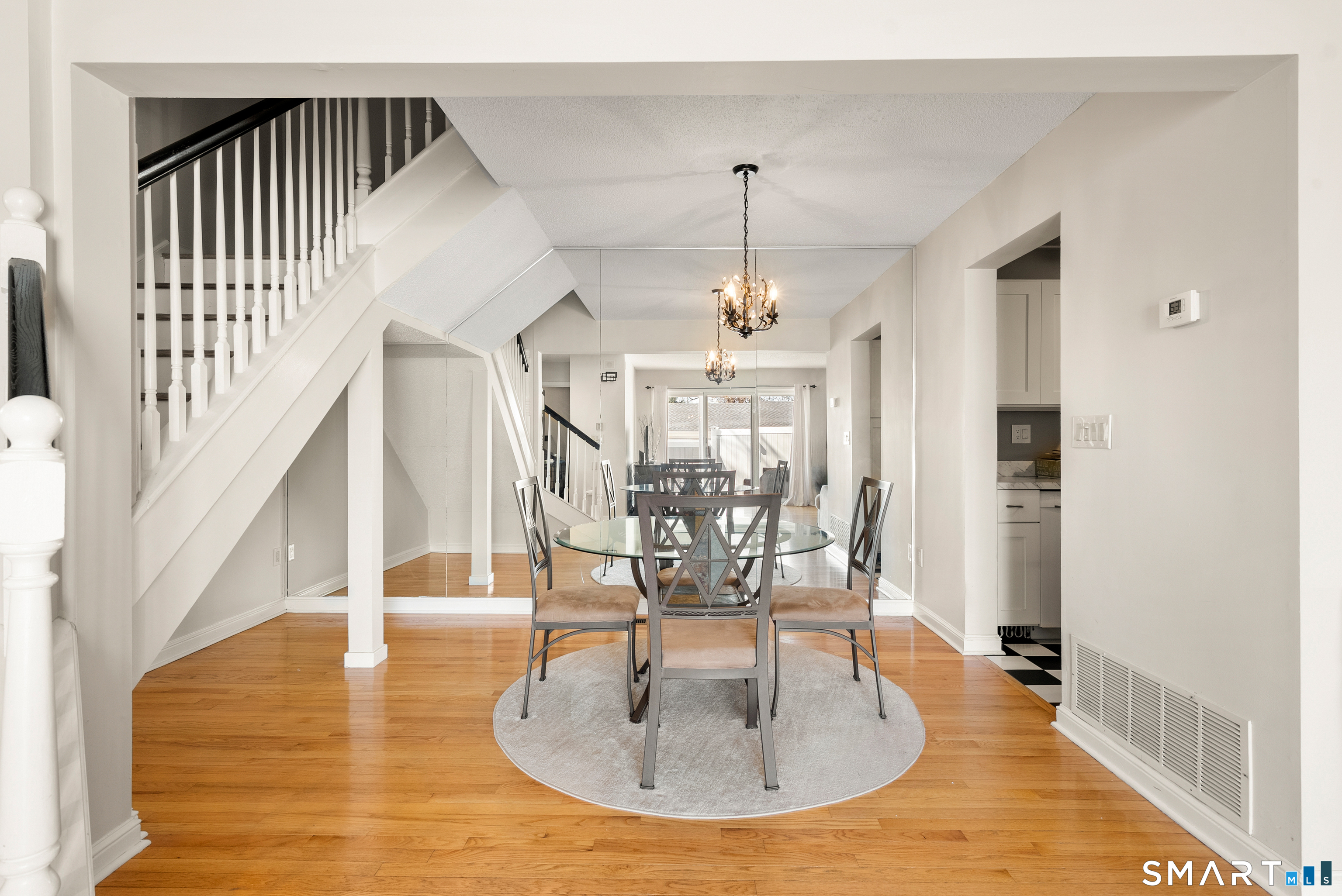 175 South End Road, Unit B10 East Haven, CT 06512 - Photo 11 of 32 a view of a livingroom with wooden floor and staircase