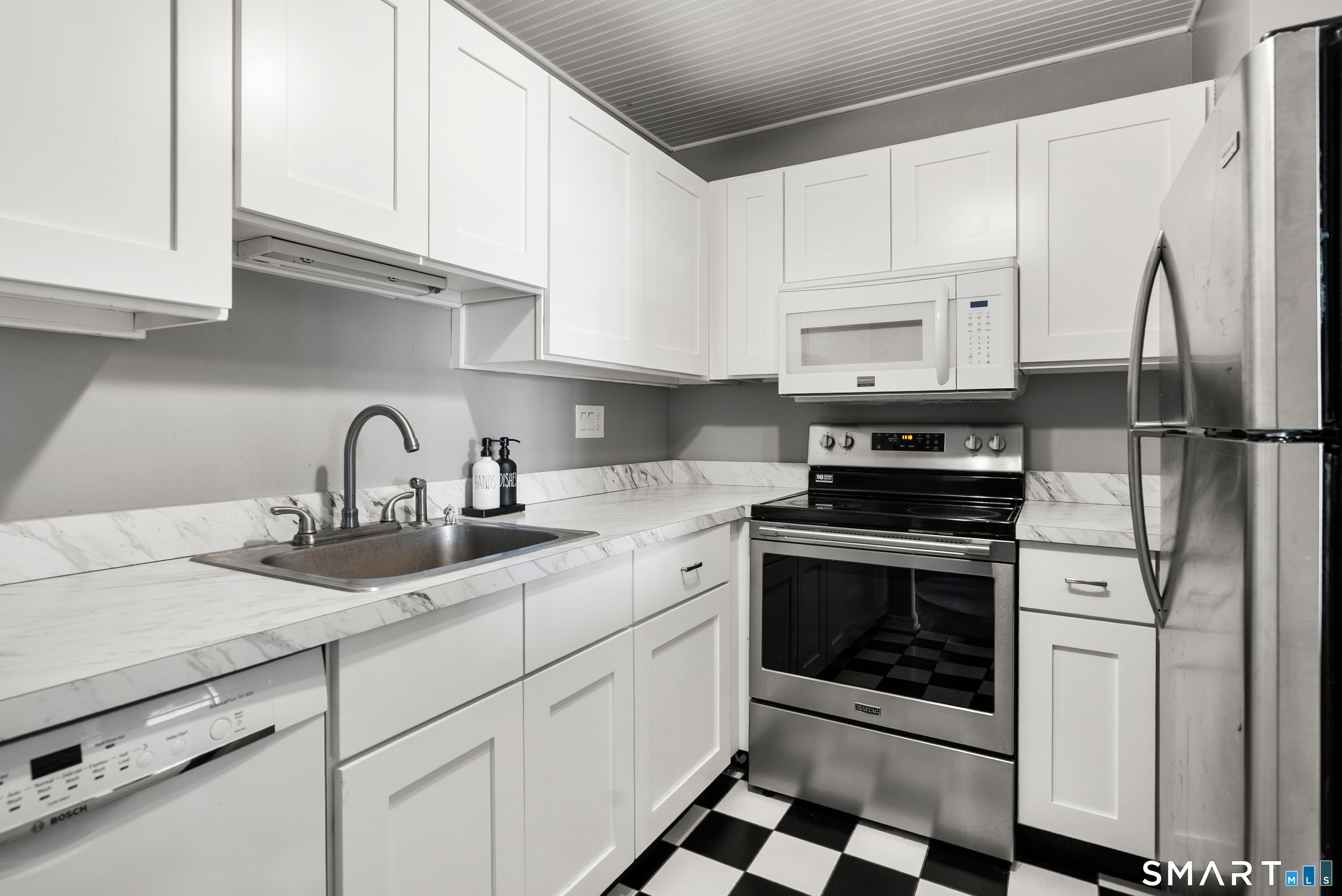 175 South End Road, Unit B10 East Haven, CT 06512 - Photo 13 of 32 a kitchen with appliances cabinets and a sink