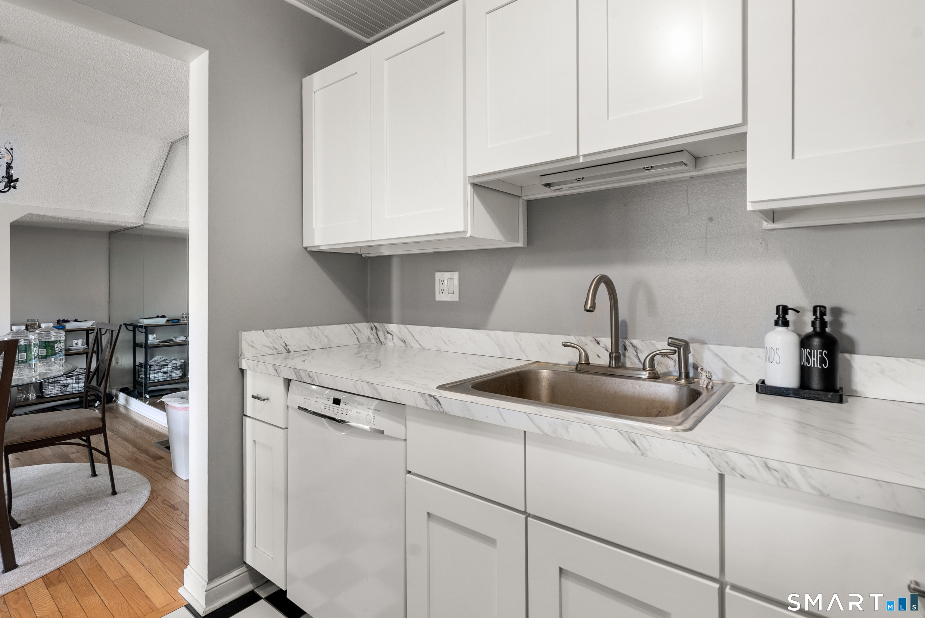 175 South End Road, Unit B10 East Haven, CT 06512 - Photo 14 of 32 a kitchen with stainless steel appliances granite countertop a sink and a white cabinets