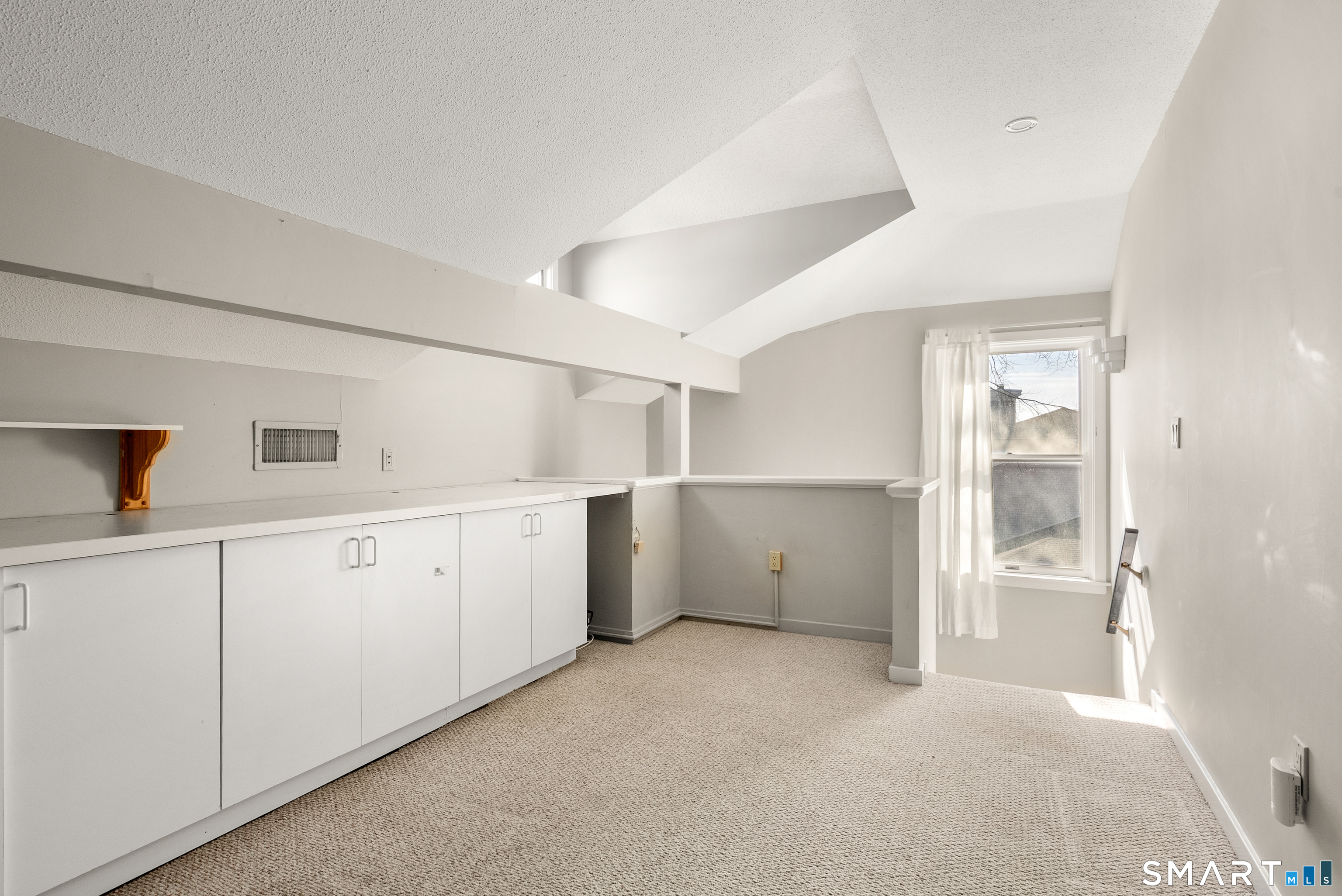 175 South End Road, Unit B10 East Haven, CT 06512 - Photo 23 of 32 a view of cabinets and window