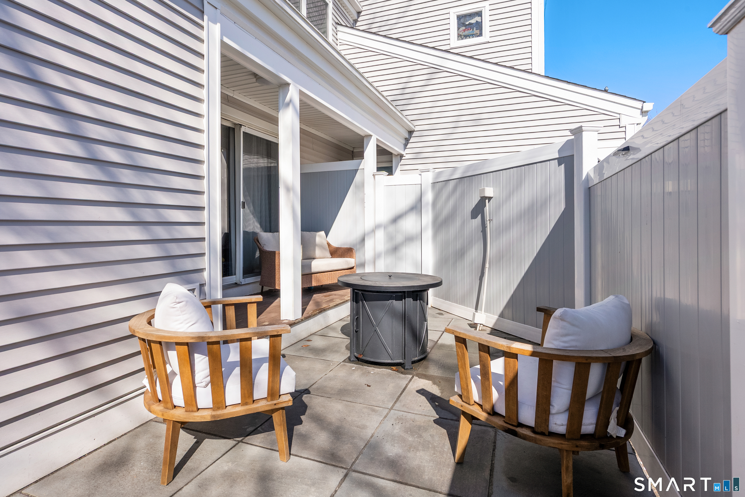 175 South End Road, Unit B10 East Haven, CT 06512 - Photo 26 of 32 a view of a patio with two chairs and a potted plant