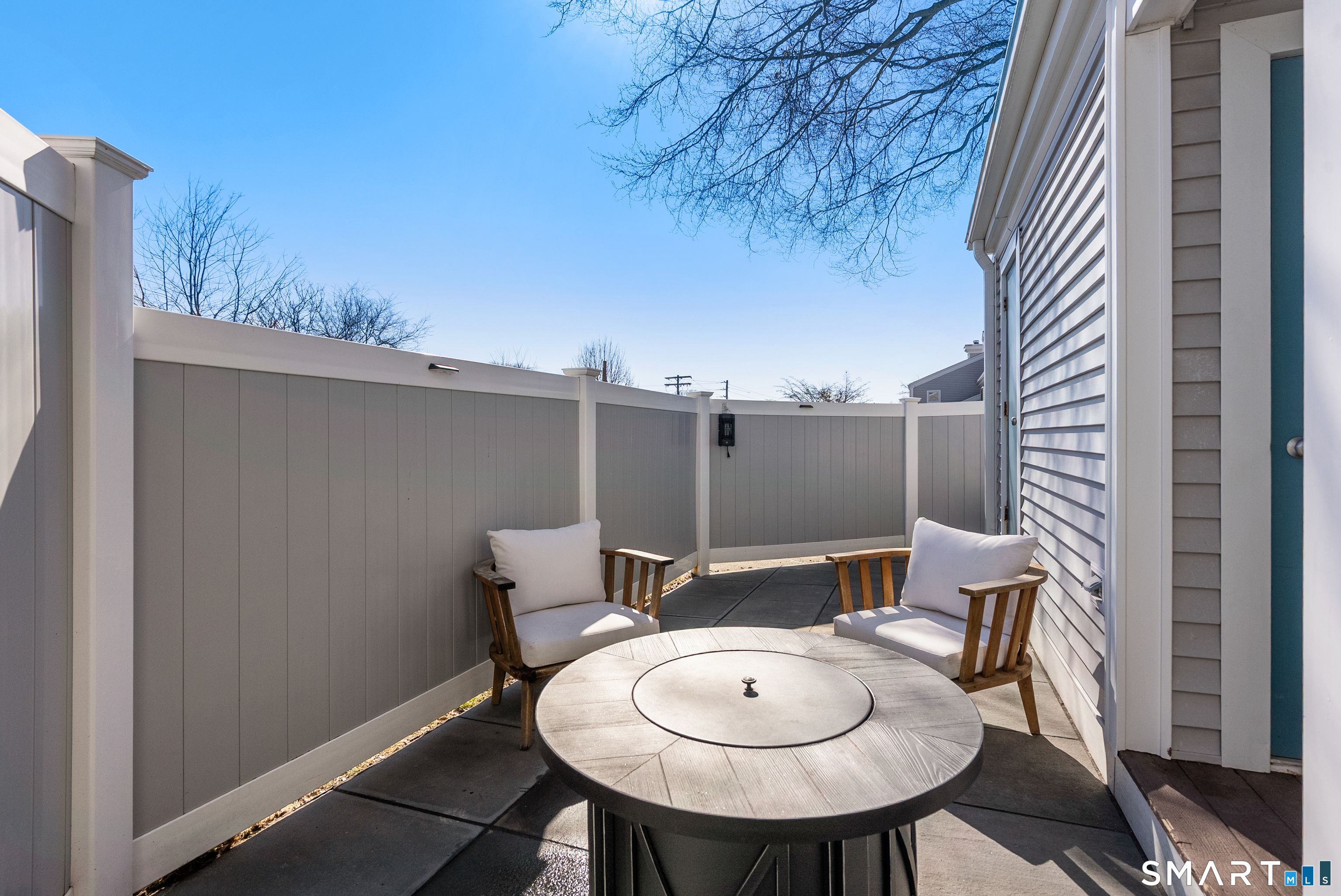 175 South End Road, Unit B10 East Haven, CT 06512 - Photo 27 of 32 a view of a balcony with table and chairs