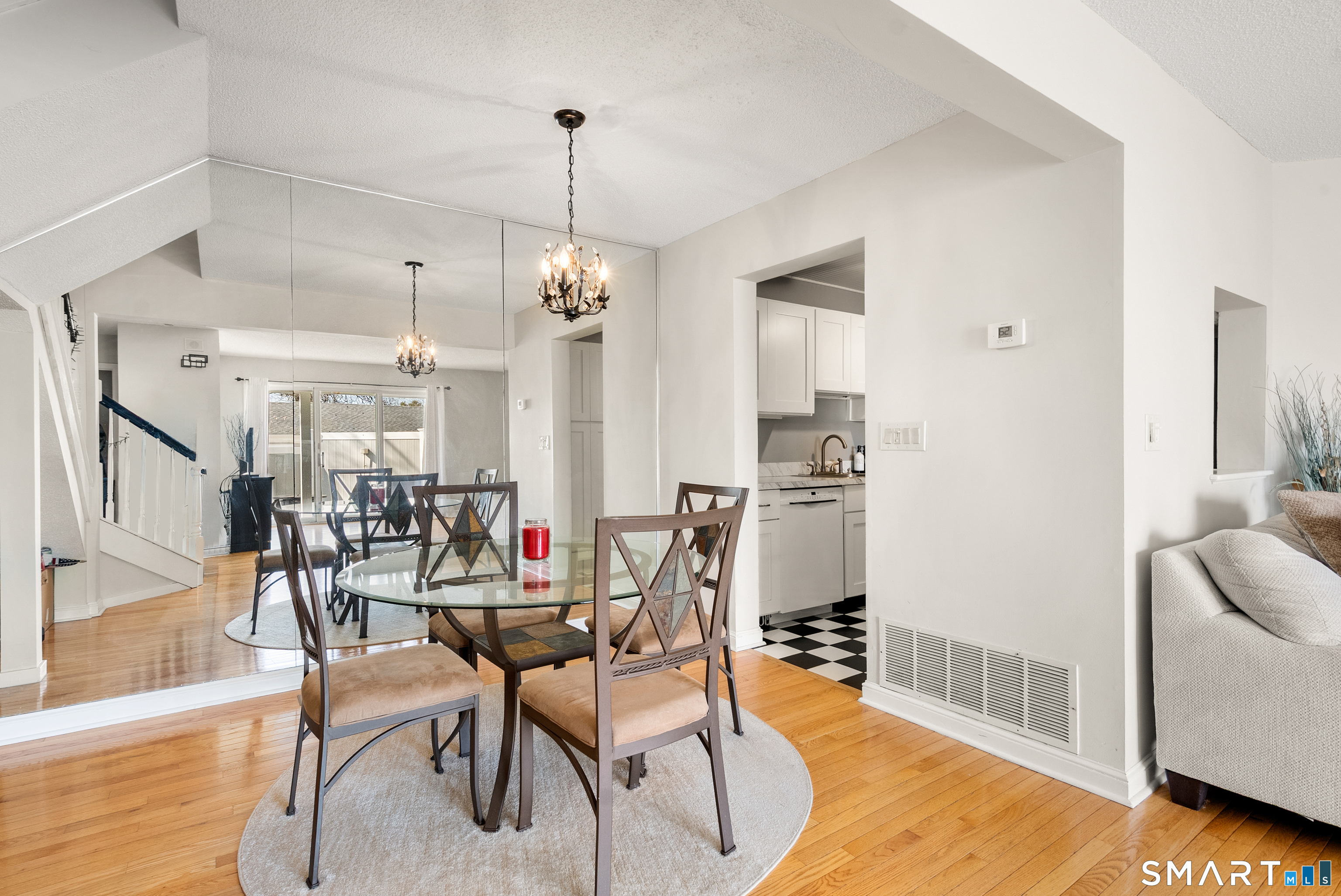 175 South End Road, Unit B10 East Haven, CT 06512 - Photo 8 of 32 a view of a dining room with furniture and wooden floor