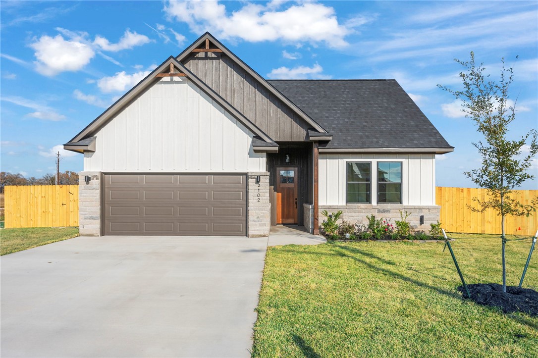 a front view of a house with yard