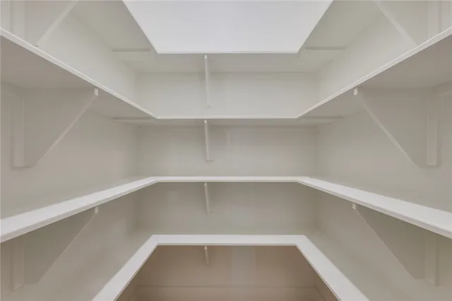 a kitchen with a sink a stove and a microwave