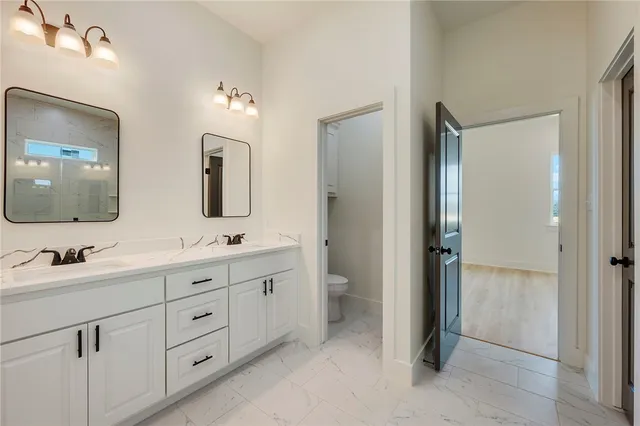 a view of an empty room with a ceiling fan