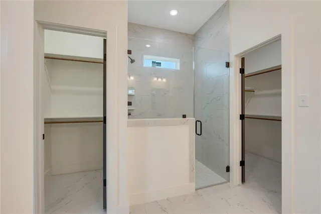 a bathroom with double sink and three mirror