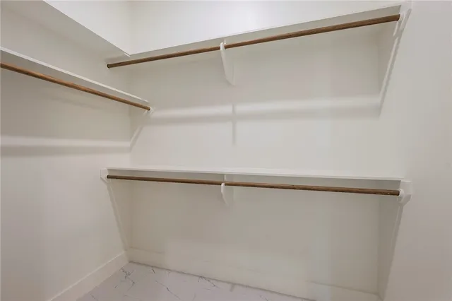 a bathroom with a shower and a glass door