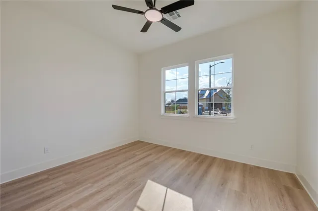 an empty room with fan