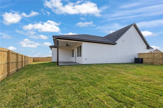 a backyard of a house with lots of green space