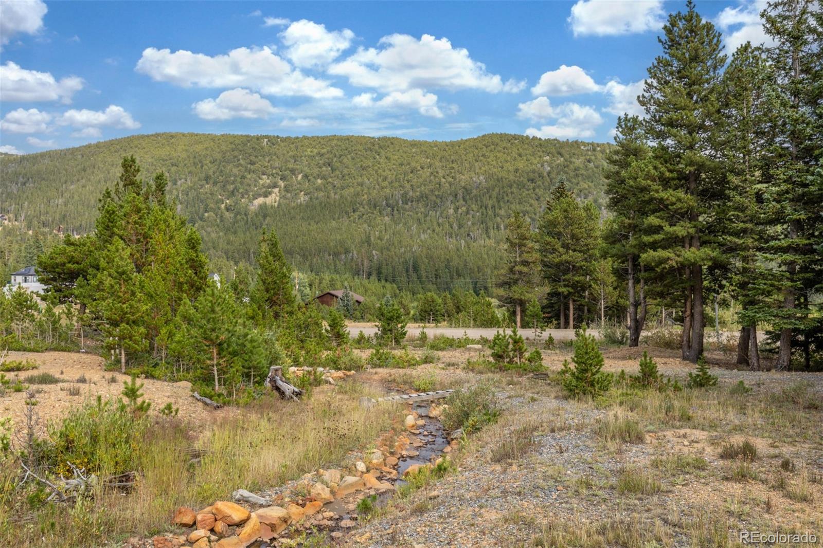 Beaver Road Idaho Springs, CO 80452 - Photo 19 of 50 a view of a town with mountains in the background
