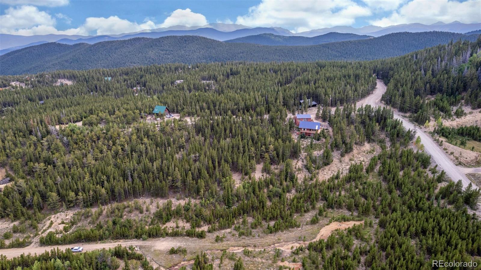 Beaver Road Idaho Springs, CO 80452 - Photo 40 of 50 a view of a lush green hillside and a houses